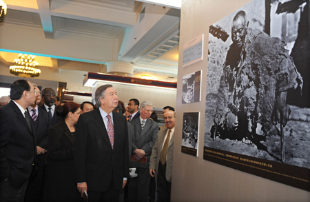 Foreign diplomats and representatives of international organizations visit the 50th Anniversary of Democratic Reforms in Tibet exhibition in Beijing, China, on March 25, 2009. [Xinhua photo]