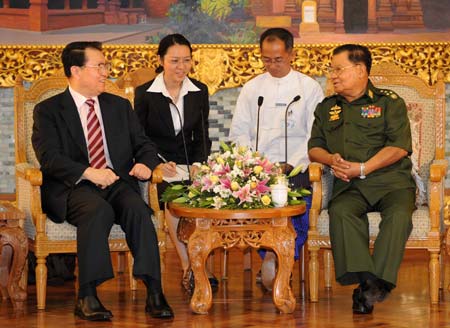 Li Changchun (1st L), a member of the Standing Committee of the Political Bureau of the Communist Party of China (CPC) Central Committee, meets with Than Shwe (1st R), chairman of the Myanmar State Peace and Development Council (SPDC), in Nay Pyi Taw, capital of Myanmar, March 26, 2009. (Xinhua/Liu Jiansheng)