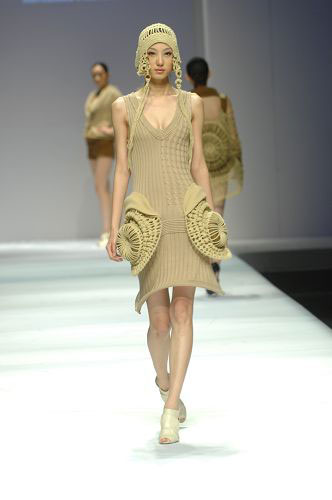 Models present knitwear creations at the WSM Designing Contest held during the China Fashion Week in Beijing on March 26, 2009. 