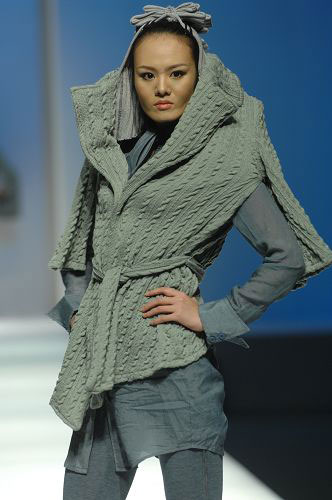 Models present knitwear creations at the WSM Designing Contest held during the China Fashion Week in Beijing on March 26, 2009. 