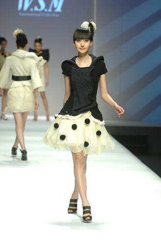 Models present knitwear creations at the WSM Designing Contest held during the China Fashion Week in Beijing on March 26, 2009.