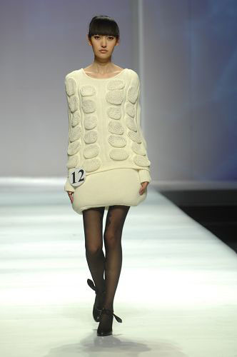Models present knitwear creations at the WSM Designing Contest held during the China Fashion Week in Beijing on March 26, 2009. 