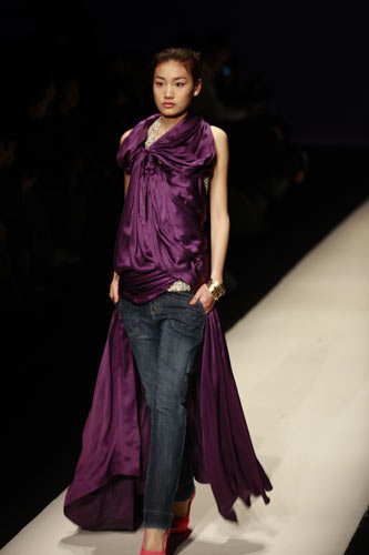 Models present the latest designs from fashion brand Miss Sun during the China Fashion Week in Beijing on March 26, 2009. 