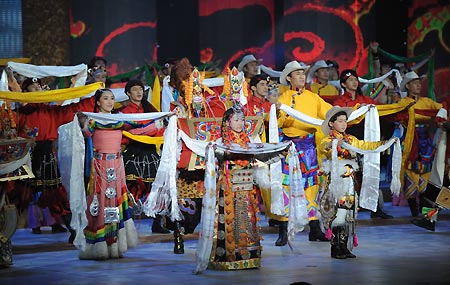 Artists perform dance at a gala to celebrate the 50th anniversary of the emancipation of Tibetan serfs in Beijing, capital of China, March 28, 2009. (Xinhua/Fan Rujun)
