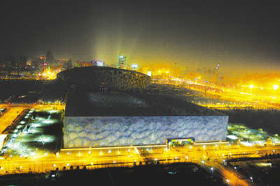The iconic 'Bird's Nest' National Stadium and 'Water Cube', the most prominent 2008 Olympic venues usually illuminated by floodlights, went dark in Beijing at 8:30 p.m., March 28, 2009. [People's Daily]