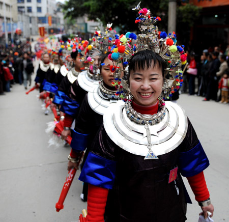 People of Dong ethnic group perform during a celebration for the traditional festival 'Sanyuesan' in Sanjiang Dong Autonomous County, southwest China's Guangxi Zhuang Autonomous Region, on March 29, 2009. The festival, which falls on March 3 of the Chinese traditional lunar calendar, was celebrated in Guangxi on Sunday, which attracts plenty of locals and visitors. [Zhang Ailin/Xinhua] 