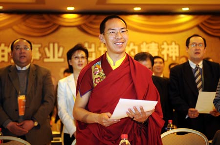 The 11th Panchen Lama, Bainqen Erdini Qoigyijabu (front) attends a sub-forum of the Second World Buddhist Forum (WBF) in Wuxi, east China's Jiangsu Province, on March 29, 2009. 