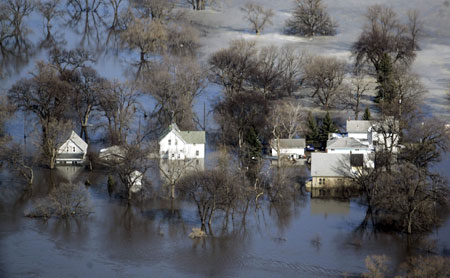 Homes along Rose Creek on the southside of Fargo, North Dakota are surrounded by flood waters March 29, 2009. 