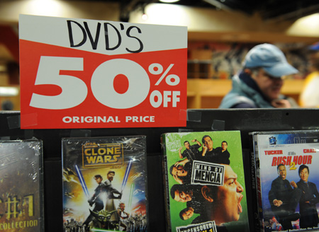 A customer views DVDs on discount at the Virgin Megastore in Times Square in New York, the United States, March 29, 2009. 