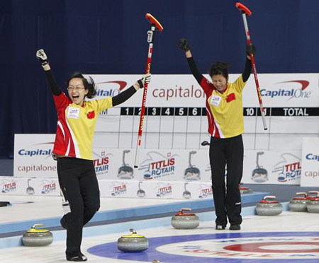 Team China lead Zhou Yan (L) and third Liu Yin celebrate their victory during their final match against Sweden at the 2009 World Women's Curling Championship in Gangneung, east of Seoul March 29, 2009.