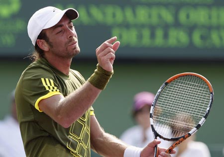 Nicolas Massu of Chile reacts after losing a point against Andy Murray of Britain during their match at the Sony Ericsson Open tennis tournament in Key Biscayne, Florida March 30, 2009.