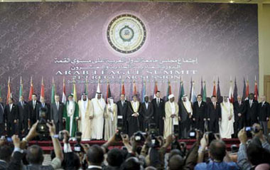 Arab League leaders pose for a group photo prior to the open session of the Arab summit in Doha, capital of Qatar, on Monday, March 30, 2009. The 21 Arab League Summit opened in Doha Monday.