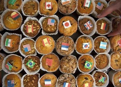 G20 cakes decorated with the flags of the attending countries sit in the media center at the recent G20 Finance Ministers' meeting in West Sussex, UK. [China Daily]