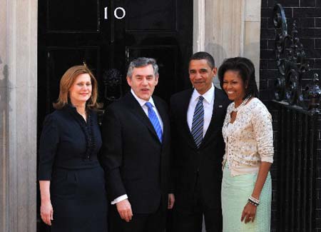 Britain's Prime Minister Gordon Brown (2nd L) and his wife Sarah (L) meet U.S. President Barack Obama and first lady Michelle in Downing Street in London April 1, 2009. World leaders will have their work cut out at a G20 summit where Obama makes his first major international sortie, under perhaps more pressure than anyone to show that the country where the crisis began can lead the way out.