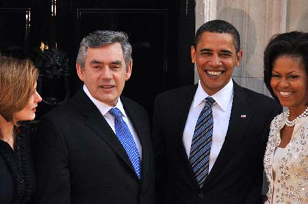 Britain's Prime Minister Gordon Brown (2nd L) and his wife Sarah (L) meet U.S. President Barack Obama and first lady Michelle in Downing Street in London April 1, 2009. World leaders will have their work cut out at a G20 summit where Obama makes his first major international sortie, under perhaps more pressure than anyone to show that the country where the crisis began can lead the way out.