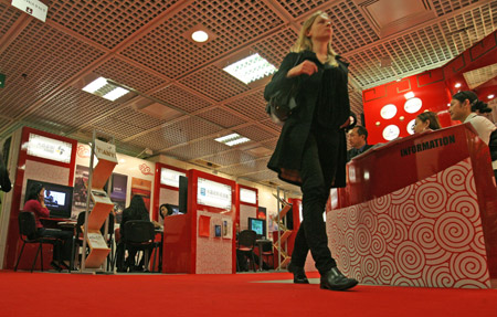 A participant walks by Chinese exhibition area at the Palais Des Festivals, the venue for MIPTV, an annual international fair for entertainment content industry, in Cannes, France, March 30, 2009. 