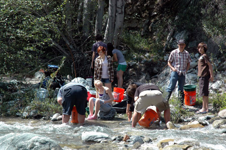 Parents with their kids seek for gold in the San Gabriel Mountains, Los Angeles, California, the United States, March 29, 2009.