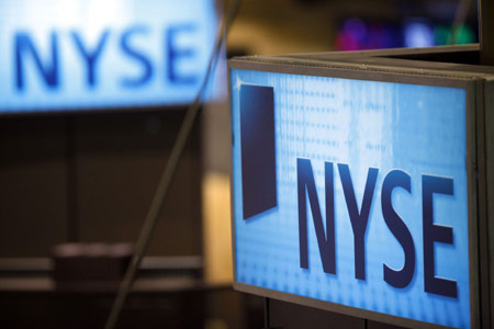 Signs are pictured above the floor of the New York Stock Exchange, March 27, 2009. Wall Street rebounded from steep losses on Tuesday as a rally in financial and technology sectors led the U.S. stocks to best monthly performance in years.[Xinhua]