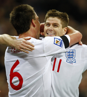 England's John Terry (L) celebrates his goal against Ukraine with teammate Steven Gerrard during their 2010 World Cup qualifying soccer match at Wembley Stadium in London April 1, 2009. 