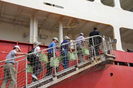 Locals step onto China's Antarctic exploration vessel the Snow Dragon, or Xuelong in Chinese, at the Kaohsiung Port in southeast China's Taiwan Province, on April 1, 2009. (Xinhua