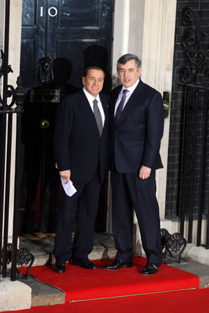 British Prime Minister Gordon Brown (R) shakes hands with Italian Premier Silvio Berlusconi at No. 10 Downing Street in London April 1, 2009.