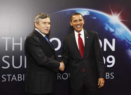 United States President Barack Obama (R) arrives at ExCel center and is greeted by British Prime Minister Gordon Brown for the summit of the Group of 20 Countries (G20) in London April 2, 2009.[Xinhua]