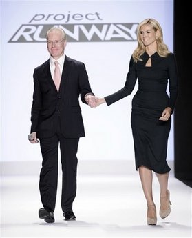 In this Sept. 12, 2008 file photo, Project Runway's Tim Gunn walks with Heidi Klum on the runway during Fashion Week in New York. 