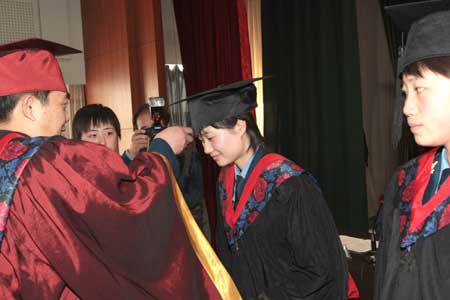 Pilot trainees attend their graduation ceremony at the Third Army Aviation Institute in China, April 2, 2009. China's first batch of female jet fighter pilots were conferred the rank of lieutenant on April 2. The 16 pilots, aged 21 to 24, graduated after 44 months of training. 