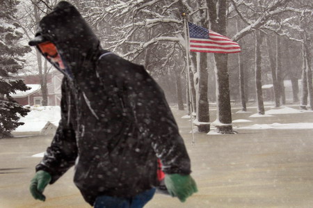 Snowstorm slows Fargo's recovery from flood