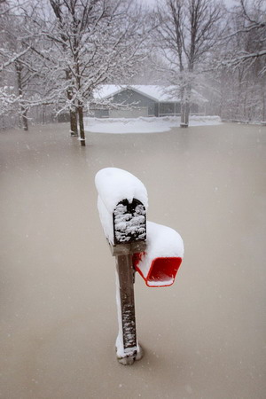 Snowstorm slows Fargo's recovery from flood