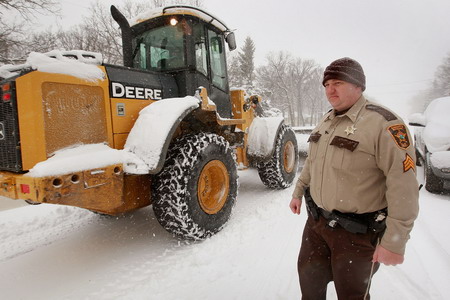 Snowstorm slows Fargo's recovery from flood