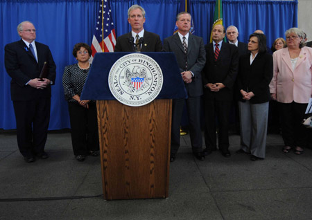 Binghamton Mayor Matthew Ryan (front) speaks at a press conference in Binghamton, New York, April 4, 2009, a day after a shooting rampage that left 14 people dead at the American Civic Association in Binghamton. 
