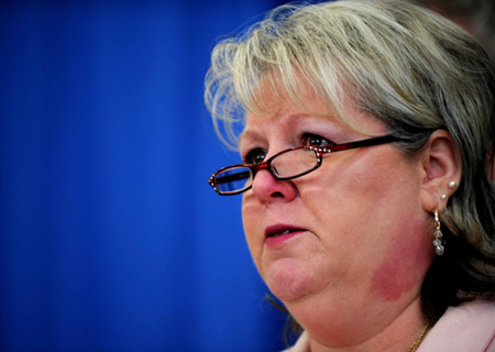 Angela Leach, President of the Board of the American Civic Association, reads a statement at a press conference in Binghamton, New York, April 4, 2009, a day after a shooting rampage that left 14 people dead at the American Civic Association in Binghamton. 