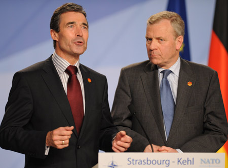 Danish Prime Minister Anders Fogh Rasmussen (L) and Current NATO Secretary-General Jaap de Hoop Scheffer attend a news conference in Strasbourg, France, on April 4, 2009. Leaders of NATO member states managed to agree on Saturday to appoint Danish Prime Minister Anders Fogh Rasmussen as new secretary general of the alliance. 