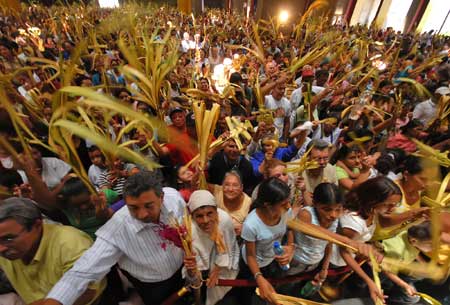 People attend a celebration of the Palm Sunday, the start of the Holy Week, in Managua, Nicaragua, April 5, 2009. The Holy Week, the second week in April, marks the Biblical story of crucifixion of Jesus Christ on the first Friday of April. 