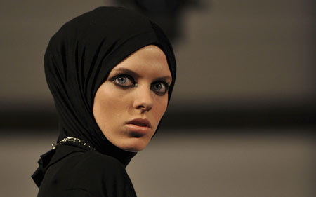 A model presents a creation by designer Rabia Z at the Arabian Fashion World in London April 6, 2009.