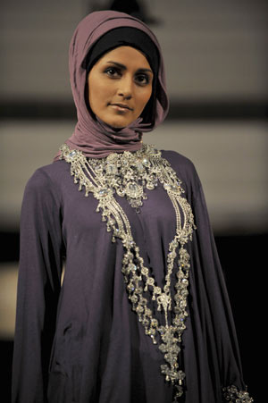 A model presents a creation by designer Rabia Z at the Arabian Fashion World in London April 6, 2009. 