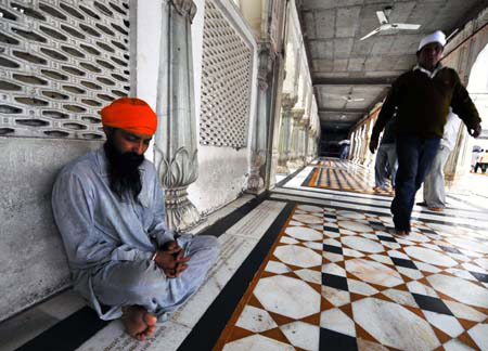 A Sikh prays inside the Golden Temple in Amritsar, India, April 7, 2009. The temple is the holiest shrine for Sikhs. (Xinhua/Wang Ye)