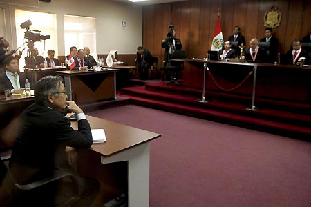 Former Peruvian President Alberto Fujimori listens to his sentence during his trial at the Special Police Headquarters in Lima, capital of Peru, April 7, 2009. Fujimori was sentenced to 25 years in prison on Tuesday after being convicted of 'crimes against humanity'.