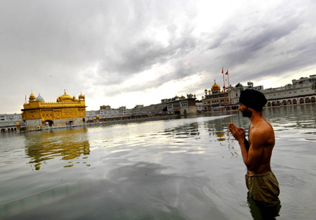 A Sikh prays at the Golden Temple in Amritsar, India, April 6, 2009. The temple is the holiest shrine for Sikhs. (Xinhua/Wang Ye) 