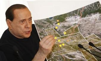 Italian premier Silvio Berlusconi shows a map of the earthquake zone during a news conference in L 'Aquila, central Italy, Wednesday , April 8, 2009.[Luca Bruno/CCTV/AP Photo] 