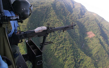 A soldier search for the wreckage during search and rescue operations for a crashed presidential chopper somewhere in the Ifugao Province of the Philippines, April 8, 2009. Philippine President Gloria Macapagal-Arroyo on Wednesday said three bodies have been found on the Bell 412 helicopter which on Tuesday crashed into the country' s northern mountainous region with her senior aids on board.