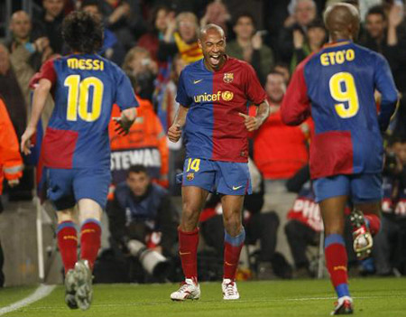 Barcelona's Thierry Henry (C) celebrates with team mates Leo Messi (L) and Samuel Eto'o after Messi's second goal against Bayern Munich during their Champions League quarter-final, first-leg soccer match at the Nou Camp stadium April 8, 2009.[