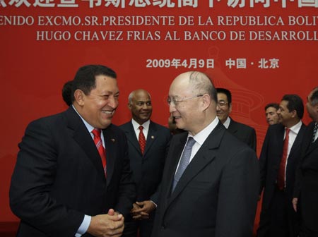 Venezuelan President Hugo Chavez (L, Front) talks with Chen Yuan (R, Front), the board chairman of the state-owned China Development Bank (CDB), in Beijing, capital of China, on April 9, 2009. Chavez held talks on strengthening cooperation with CDB board chairman Chen Yuan and CDB president Jiang Chaoliang during his visit here on Thursday. (Xinhua/Xing Guangli)