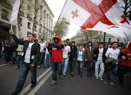 Thousands of Georgians hold a rally against Georgian President Mikheil Saakashvili, calling on his resignation, in front of Parliament Building in Tbilisi, capital of Georgia, April 9, 2009. (Xinhua/Lu Jinbo)