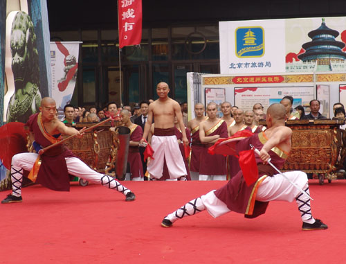 Kung Fu stars perform at the launch ceremony of the national tourism action plan in Wangfujing Street, Beijing, April 11, 2009.