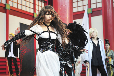 Devotees of Cosplay perform during a preliminary contest of the China COSPLAY Super Show held in Hangzhou, east China's Zhejiang Province, April 12, 2009. Around 1000 Cosplay enthusiasts took part in the contest, the winners of which will be qualified for the final of the Super Show in May. [Xinhua]