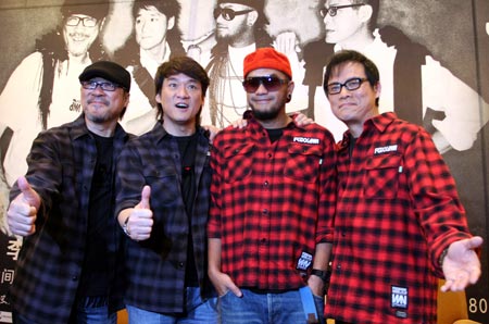 A tetrad of Chinese well-known singers Dai Yau Law, Chang Chen-yue, Chow Wah Kin, and Jonathan Lee (from R to L) strike a pose on the press meeting for a media hype about their Super Band Xi'an Concert scheduled on May 17, in Xi'an City, northwest China's Shaanxi Province, April 12, 2009. [Xinhua]