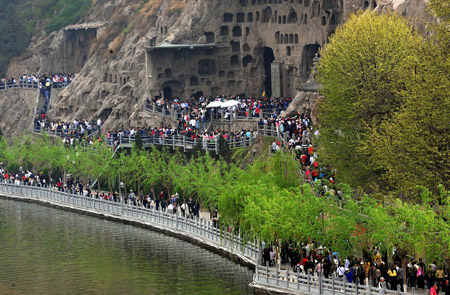 Tourists visit the Longmeng Grottoes in Luoyang City, central China's Henan Province.