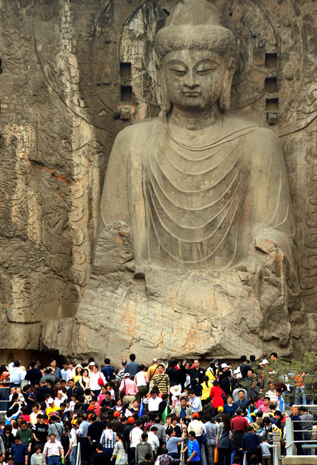 Tourists visit the Longmeng Grottoes in Luoyang City, central China's Henan Province. 